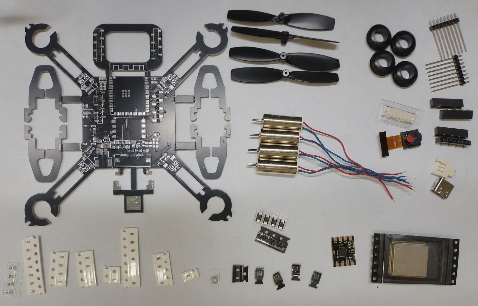 Exploded view of all micro drone parts: board, motors, props, camera and headers