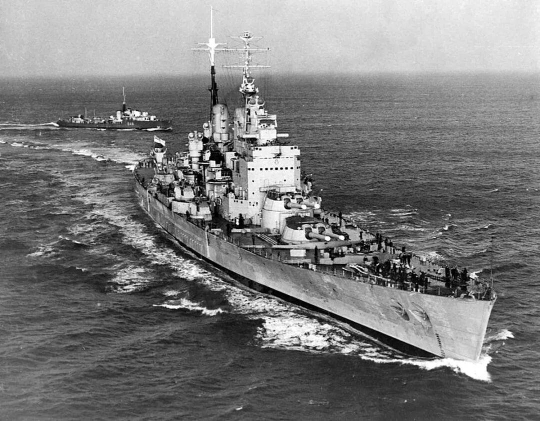 HMS Vanguard battleship underway at sea, the last Royal Navy battleship whose heavy AA fire control came from a US-built computer